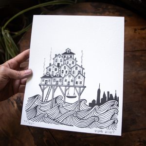 a small letterpress print on white paper depicting a group of bungalows raised on stilts over the ocean, with the NYC skyline in the background